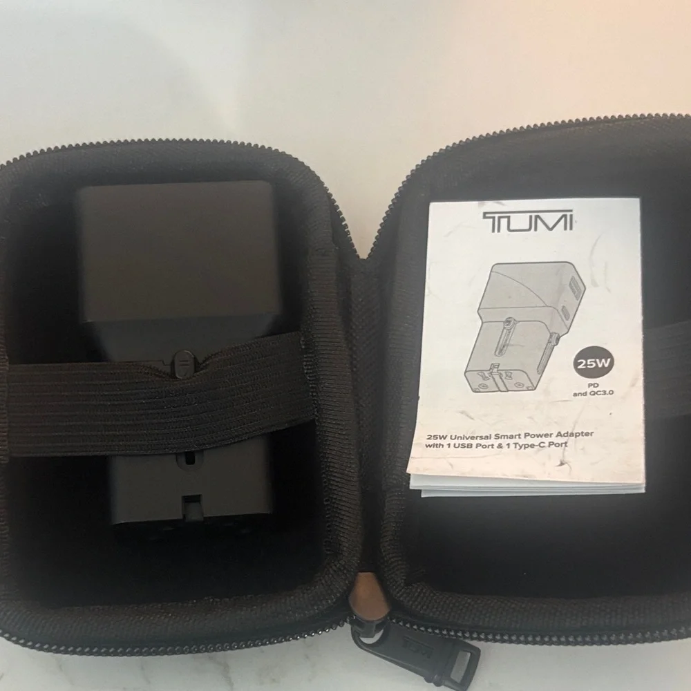 TUMI universal power adapter and case